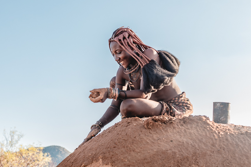 himba girl on a hut, epupa