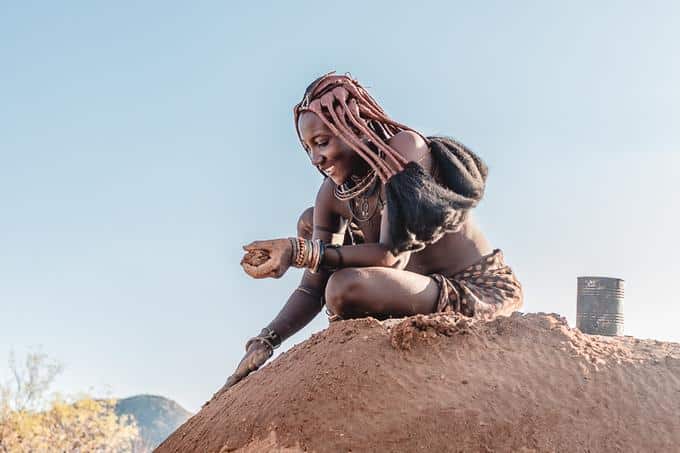 himba lady during himba activity, epupa falls lodge